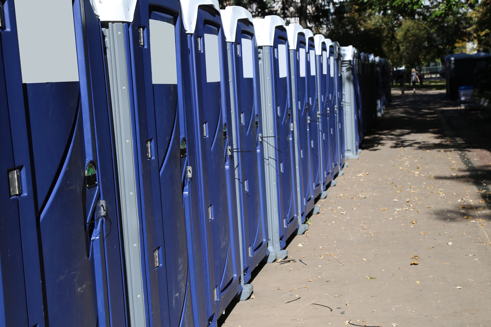 Row,Of,Portable,Toilets,On,City,Street